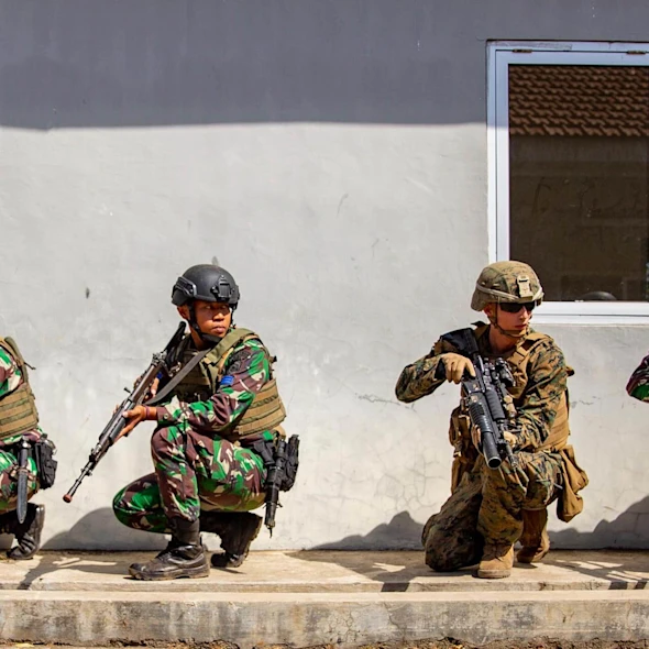 soldiers outside, ducked down