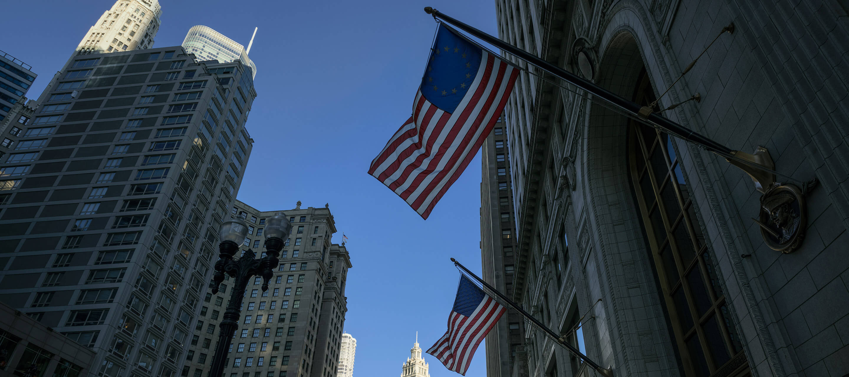 cityscapes and the American flag hanging from the building
