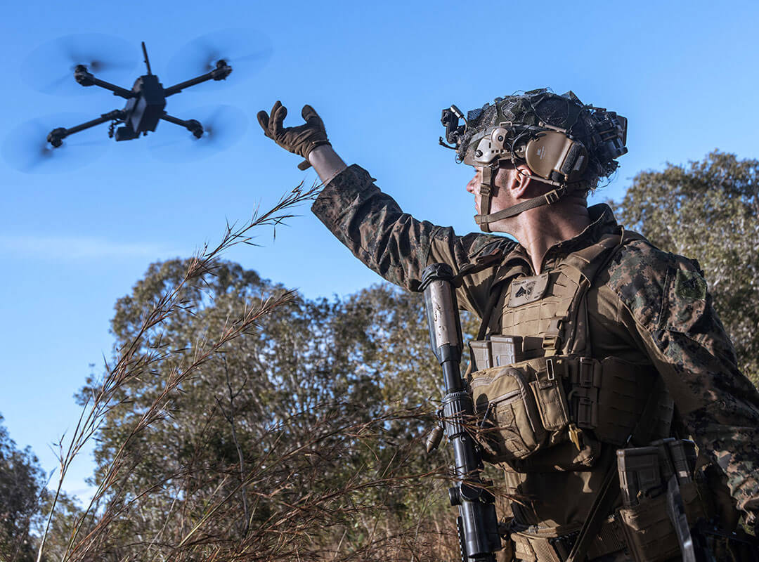 soldier launching drone