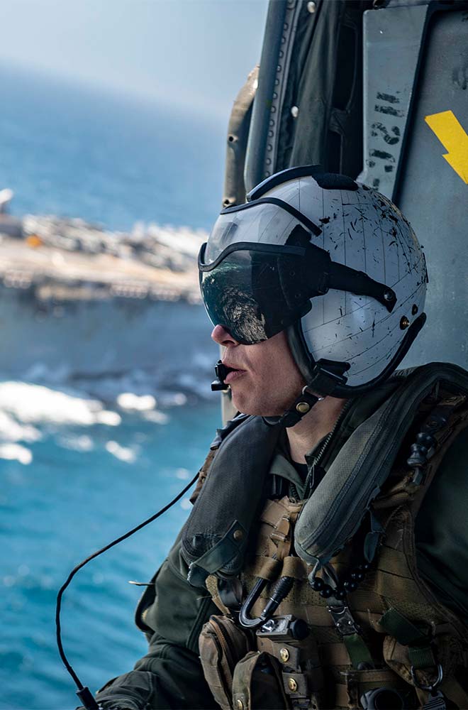 soldier overlooking water