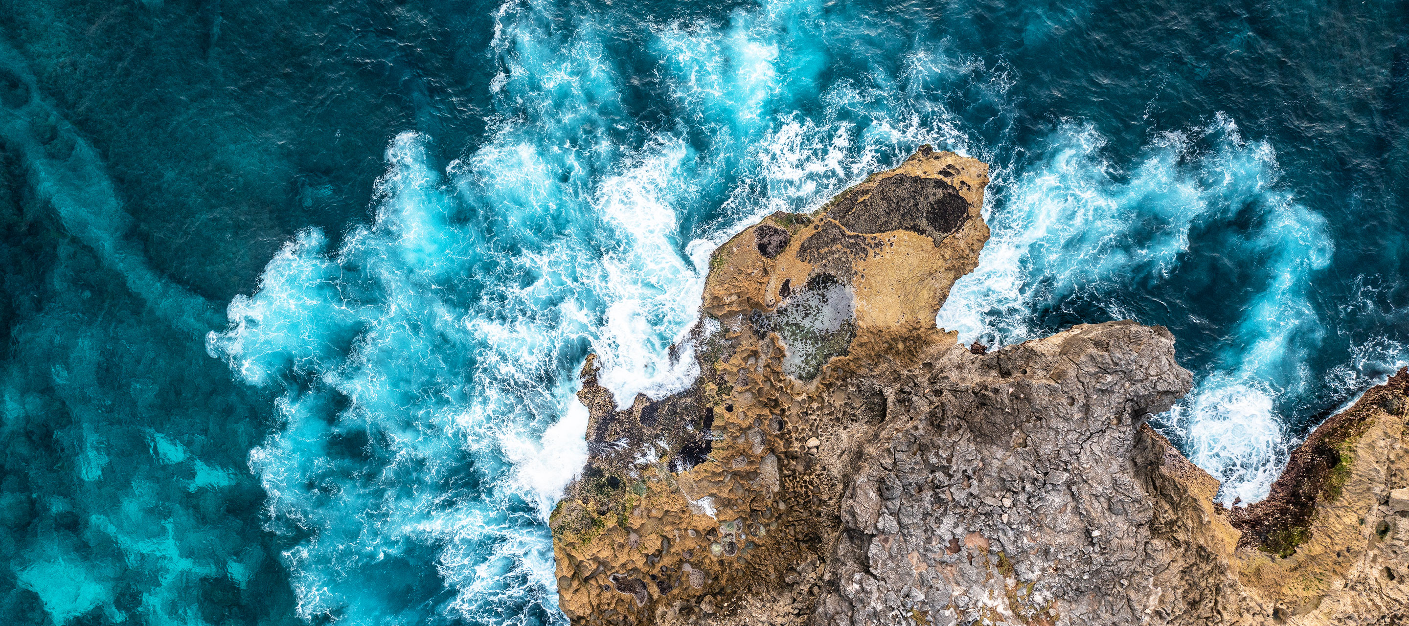 waves splashing against bedrocks