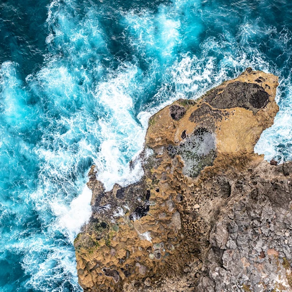 waves splashing against bedrocks