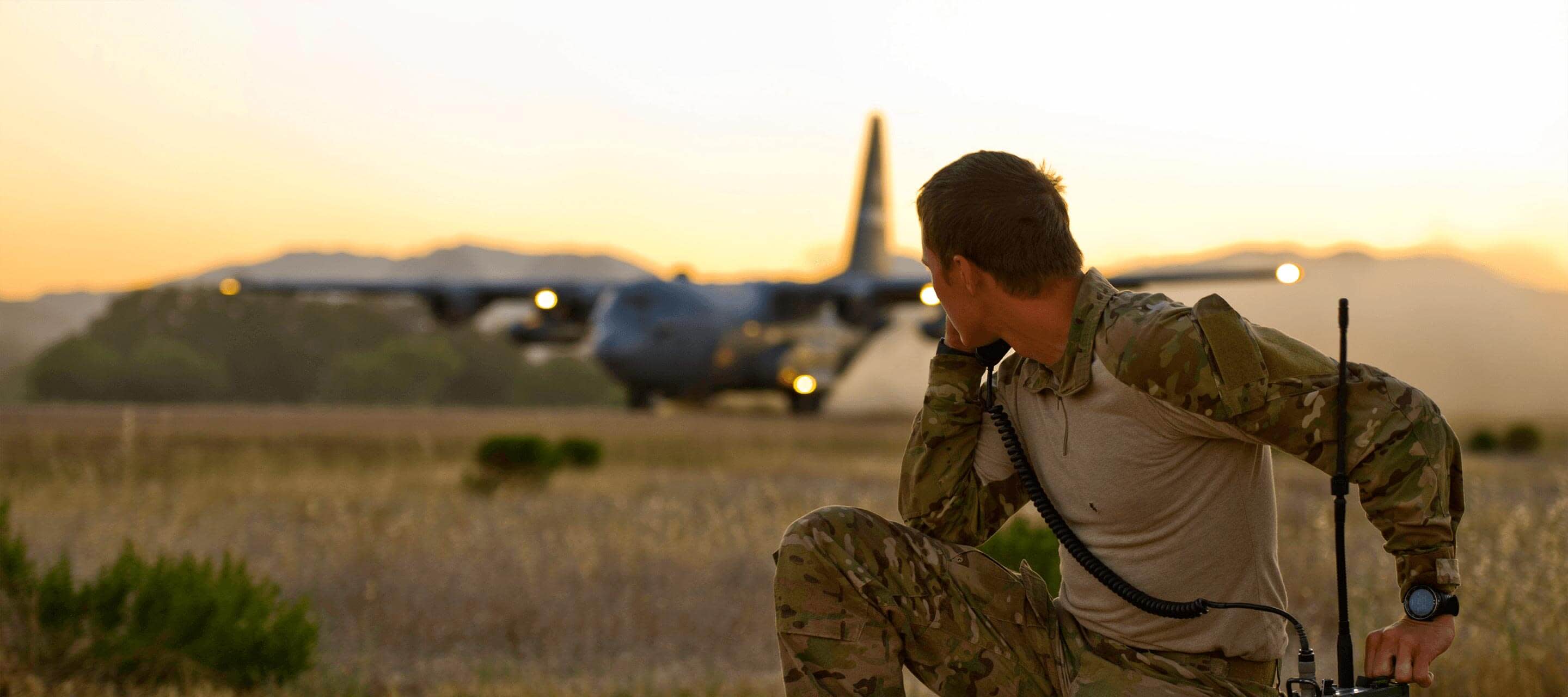 soldier looking at a plane 