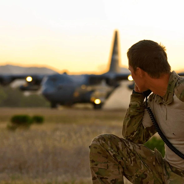 soldier looking at a plane