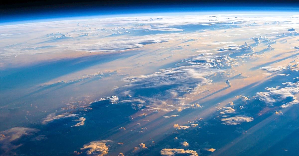 image of a photo taken from space, shows blue oceans and clouds 