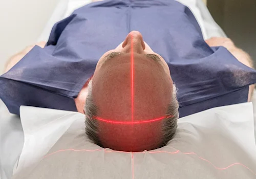 image shows man entering a MRI scan