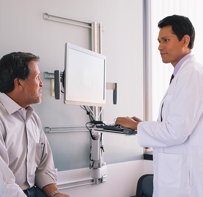 image shows doctor talking to patient 