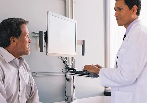 image shows doctor talking to patient