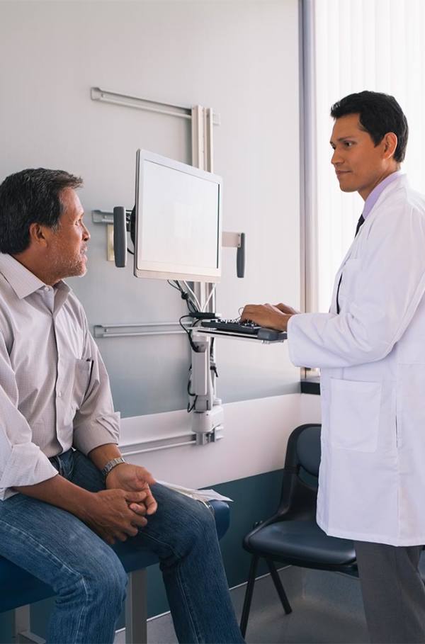 image shows doctor talking to patient 