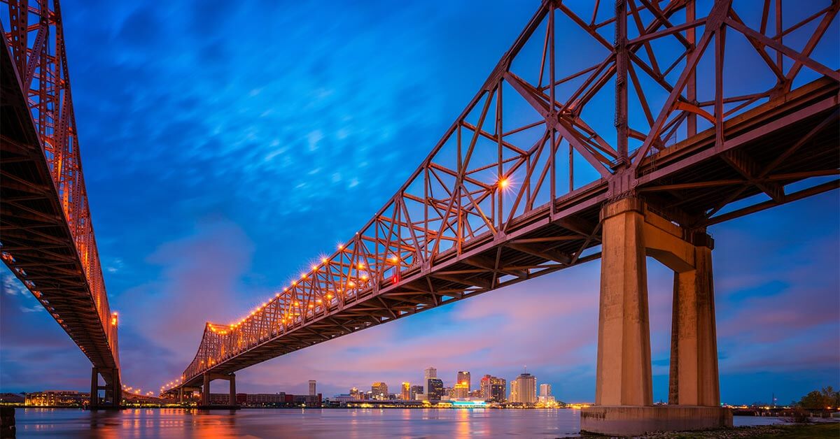 image shows view of bridge with deep blue skies