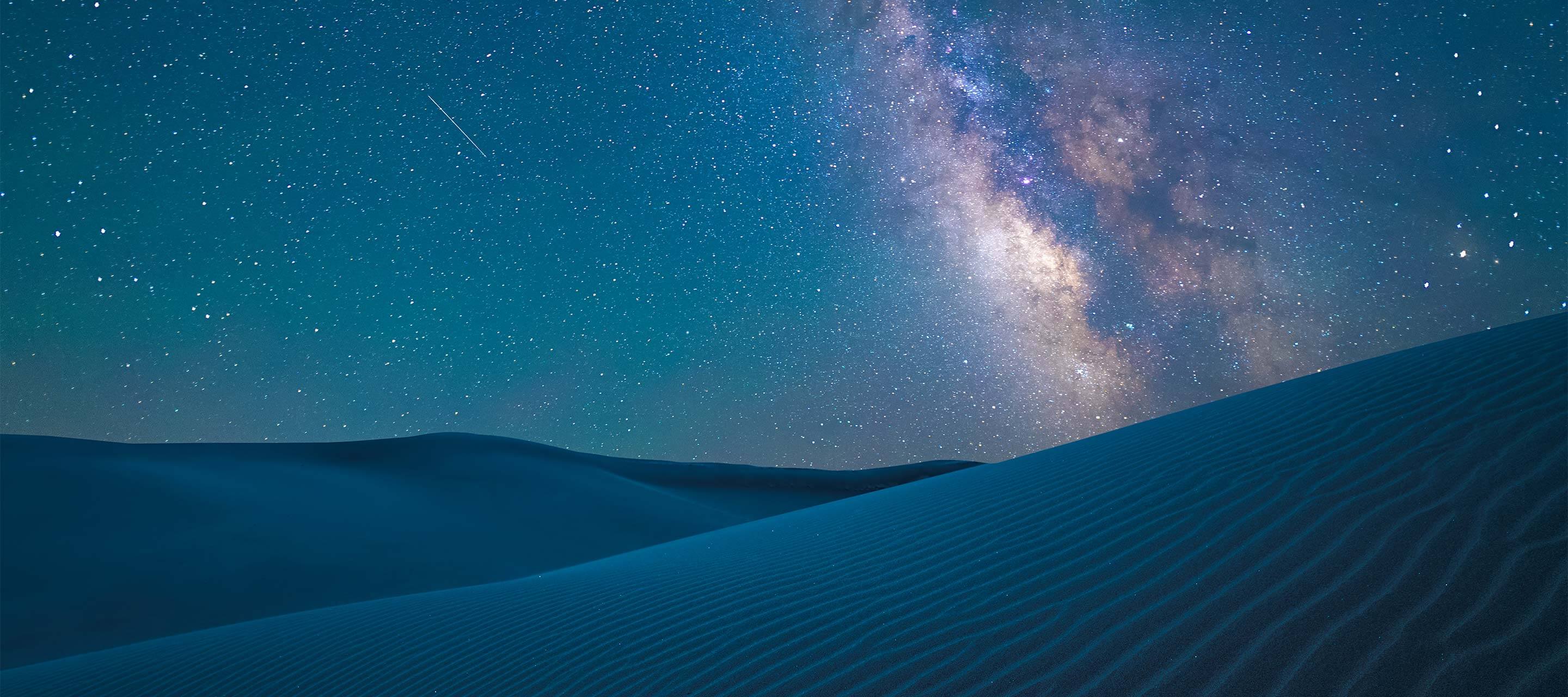 image shows night sky with stars and valleys