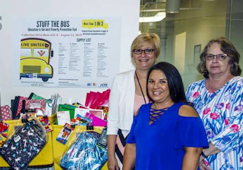 3 people posing together for a photo