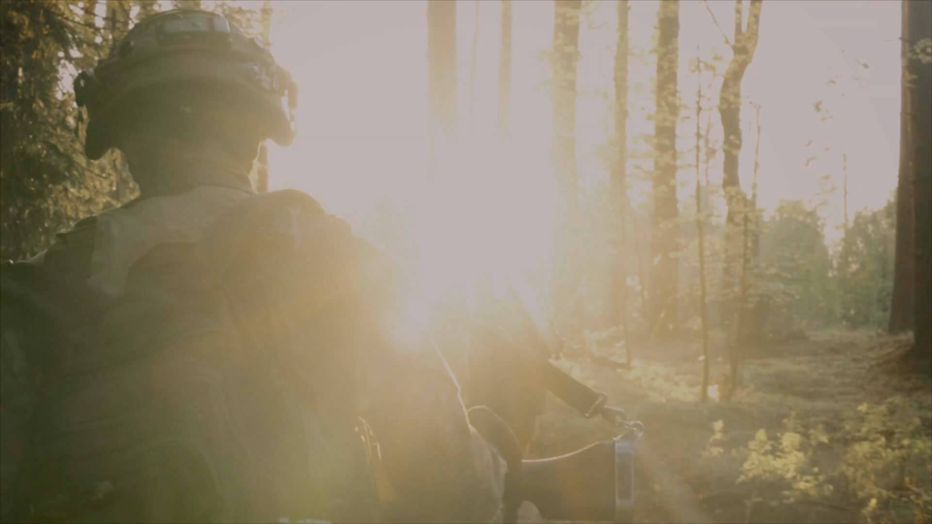 soldier walking in woods 