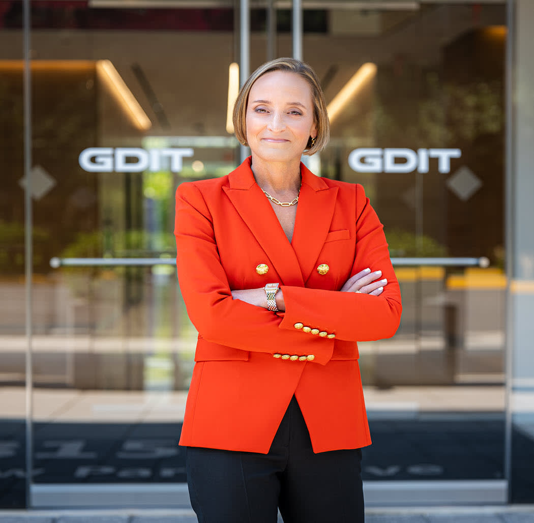 woman wearing a white blazer with arms folded