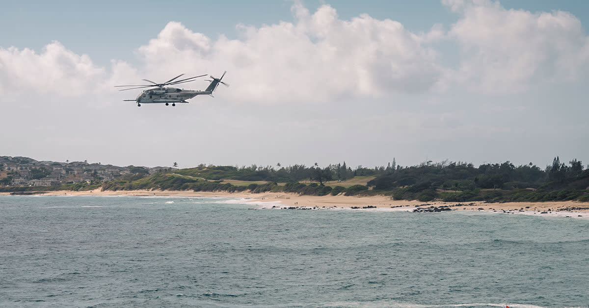 helicopter flying over water