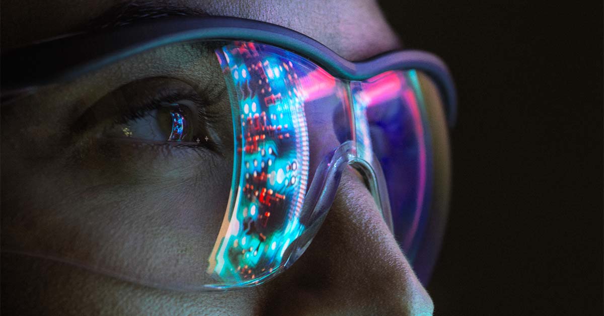 person wearing glasses that has colors reflecting