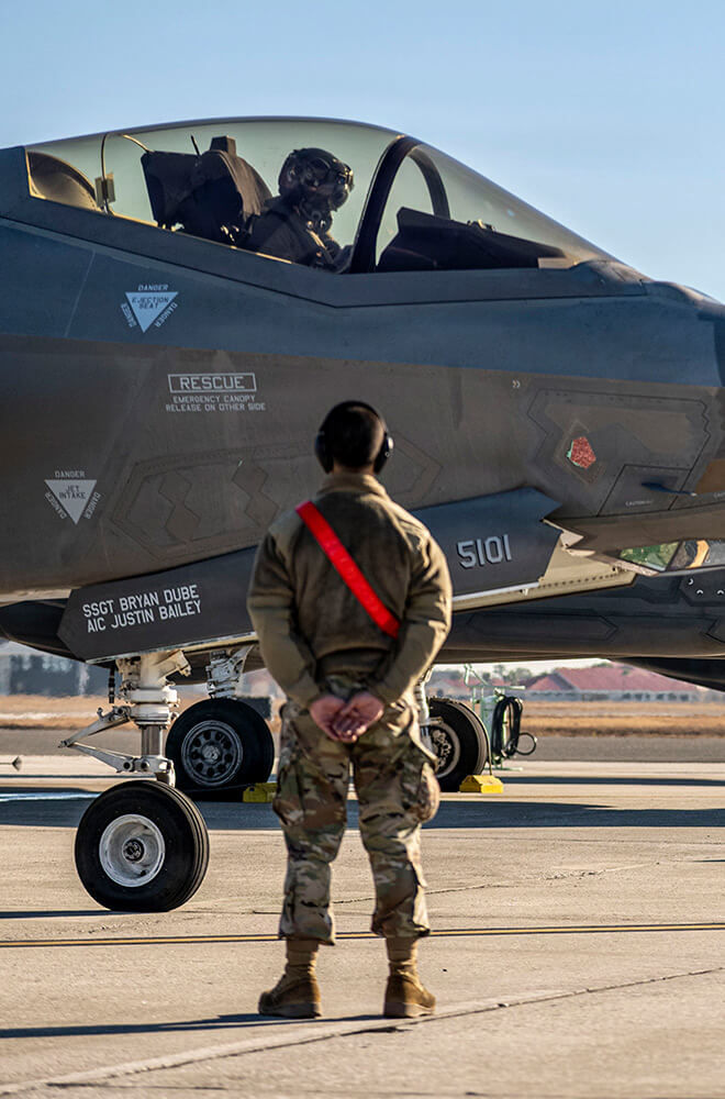 soldier looking at plane