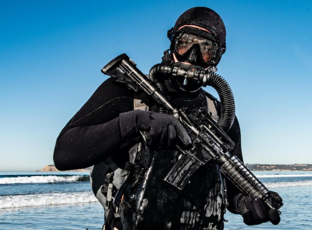 Solider standing in diving gear in water