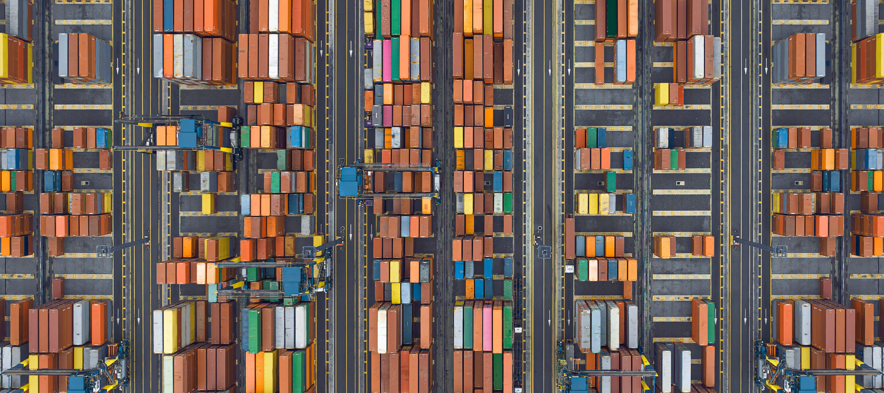 aerial view of shipyard with supply chain crates