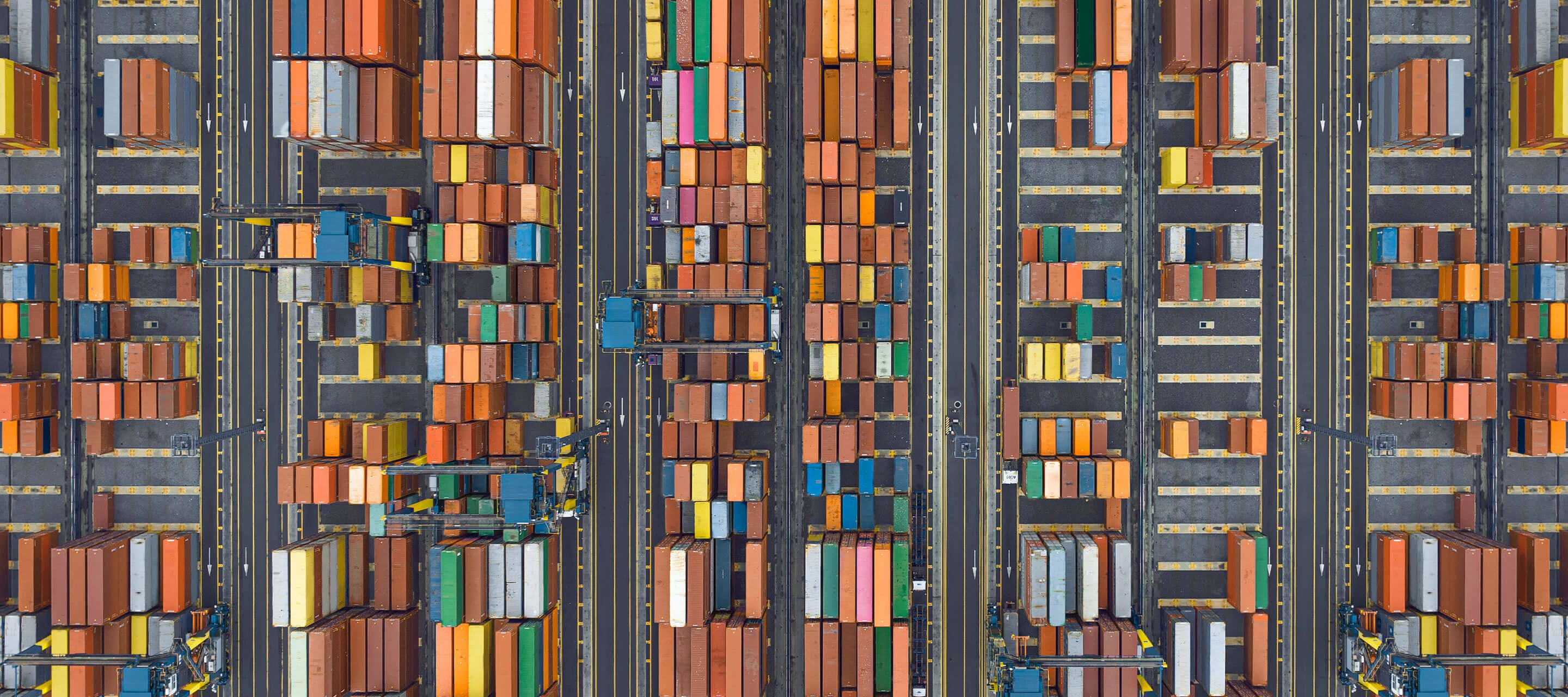 aerial view of shipyard with supply chain crates