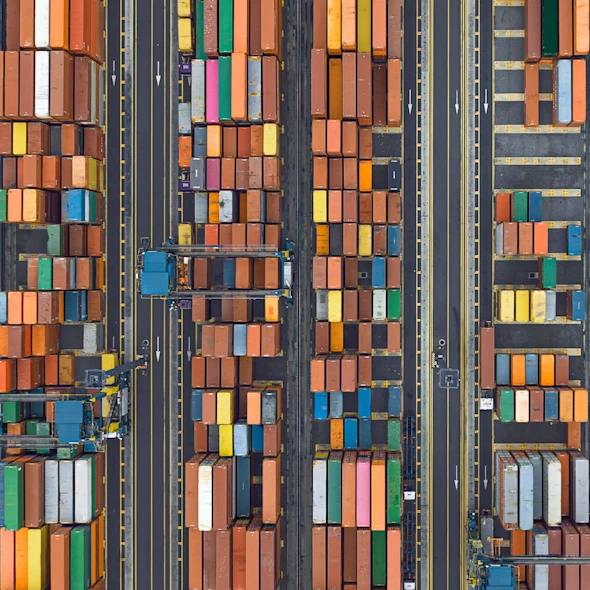 aerial view of shipyard with supply chain crates