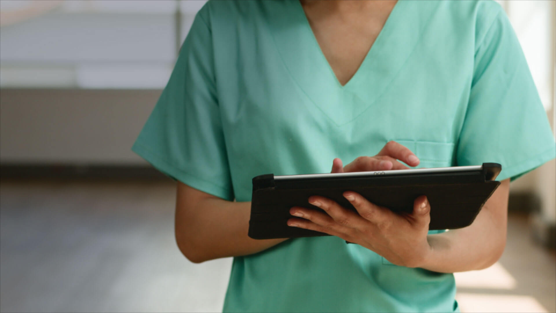 doctor looking at tablet