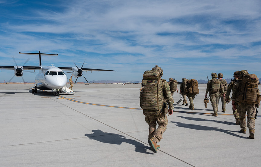 soldiers walking towards aircraft