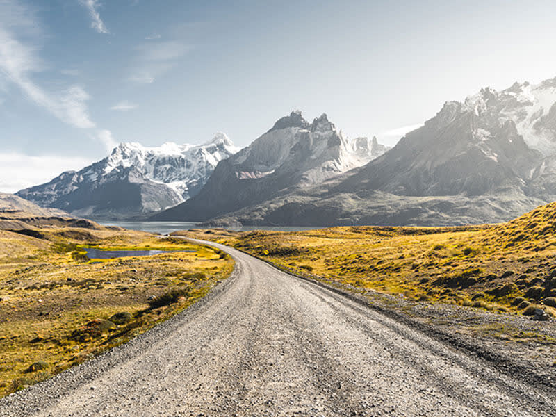 road leading to a mountainside 