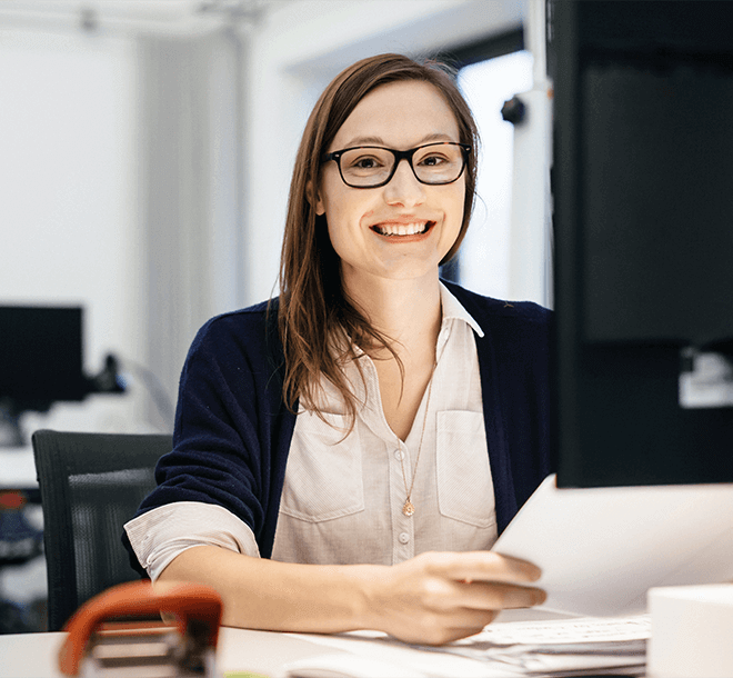 woman in office smiling