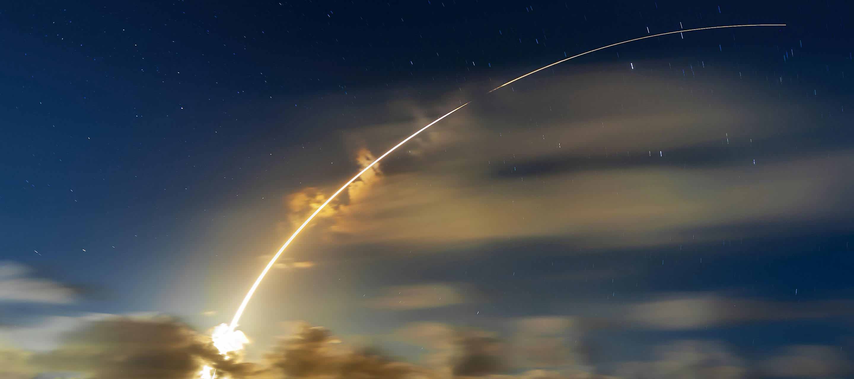 Rocket going into the sky at dusk
