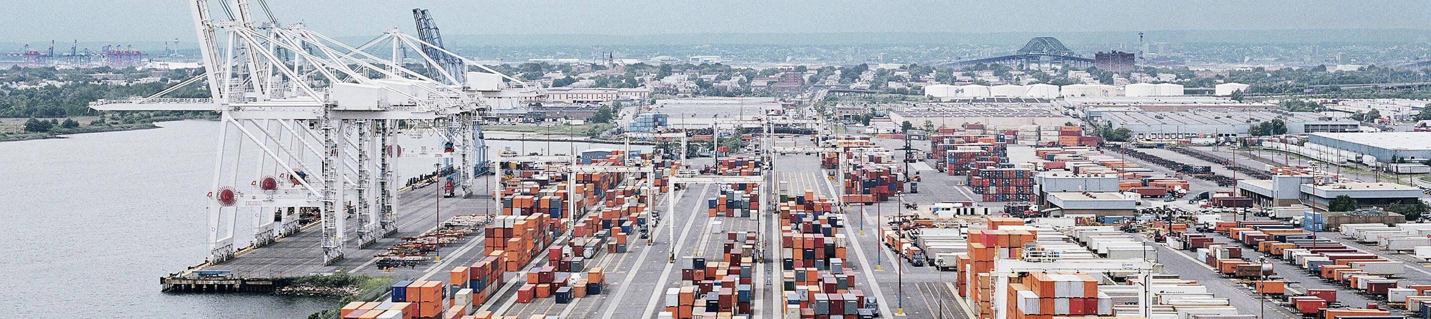 Cranes on a port with containers on land