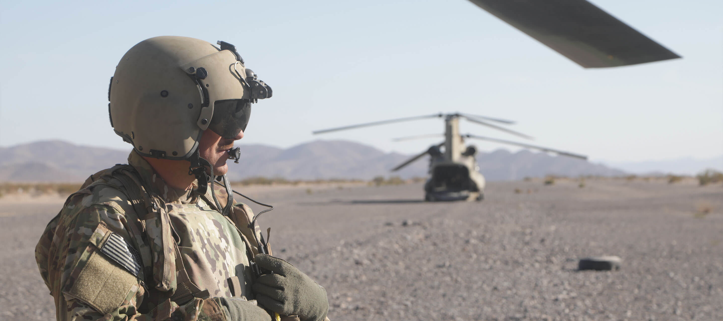 soldier on the grounds, aircraft in background