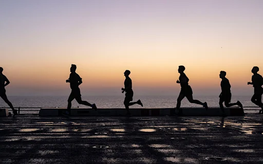 silhouettes of people running