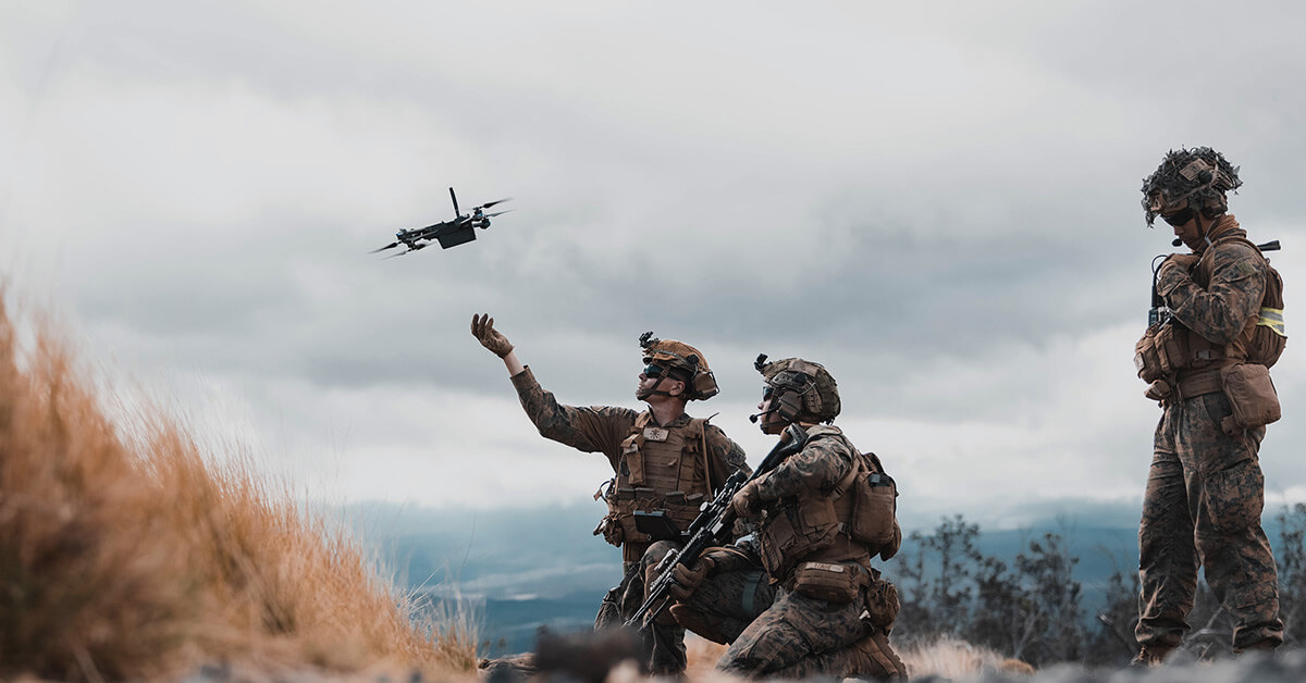 soldiers launching a drone