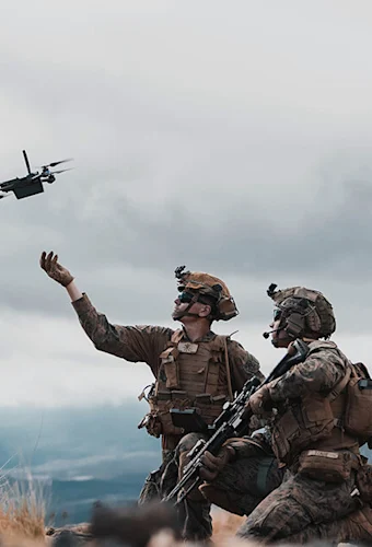 soldiers launching a drone