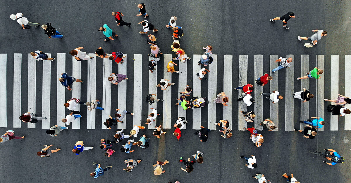 aerial view of pedestrians walking across the street