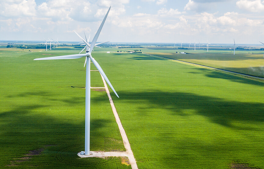 windmill in large grass field