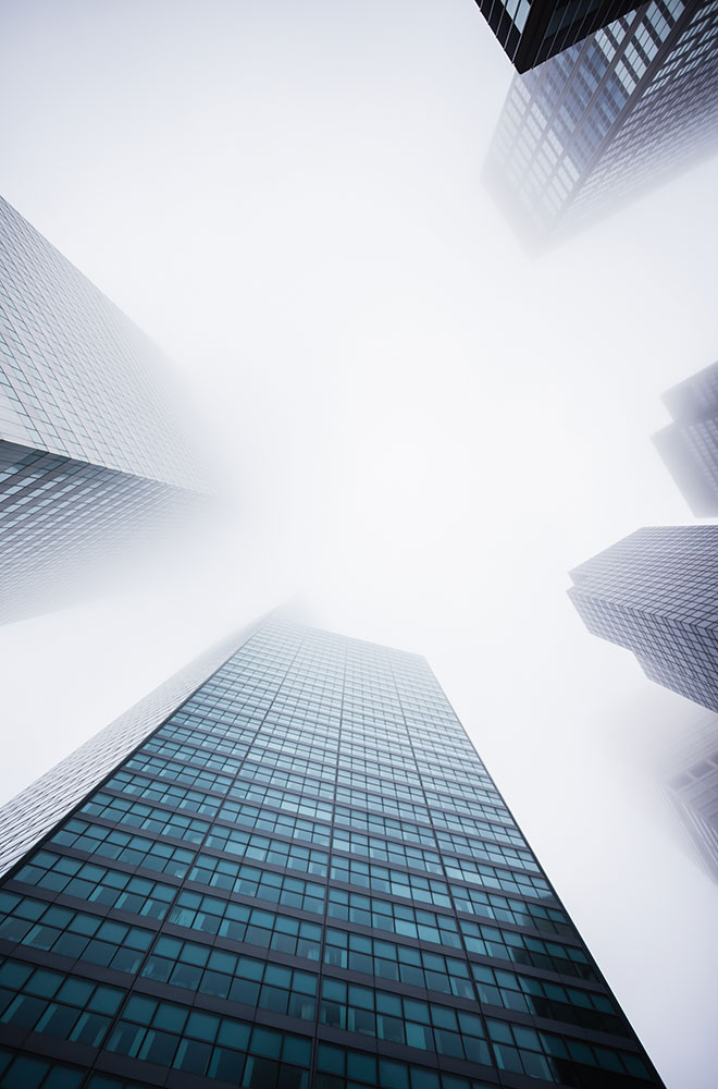 Group of skyscrapers in clouds.