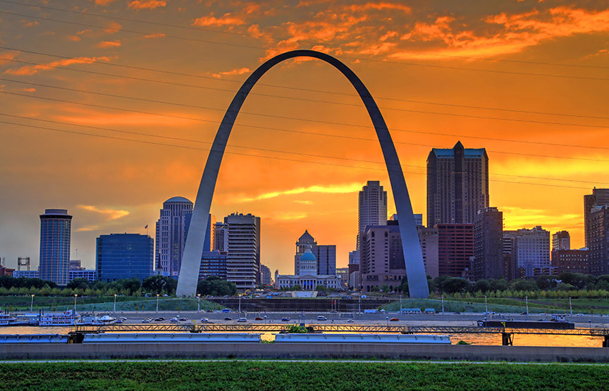 orange/yellow sky with view of St. Louis