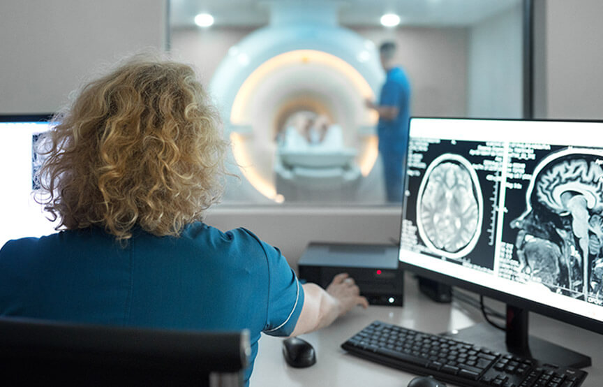 health professional looking at scans