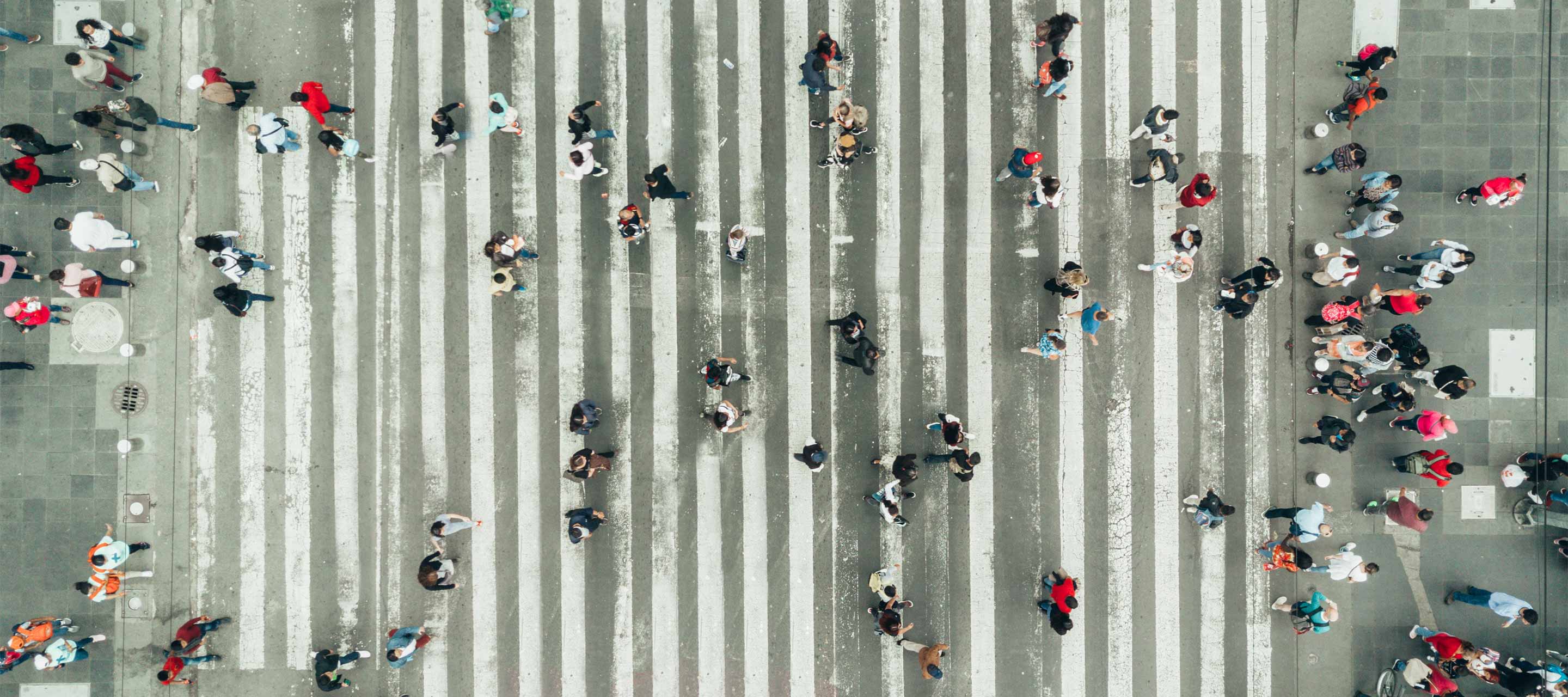 people crossing crosswalk - aerial view