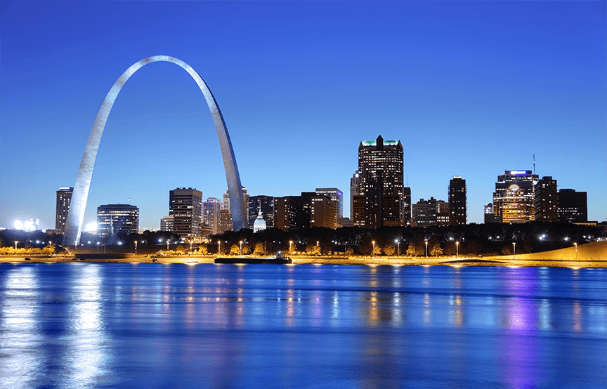 St. Louis at night showing blue waters and skyline