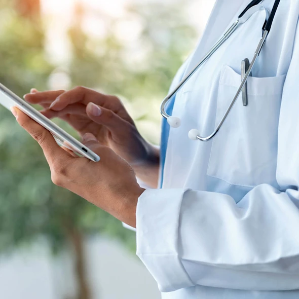 doctor looking at device