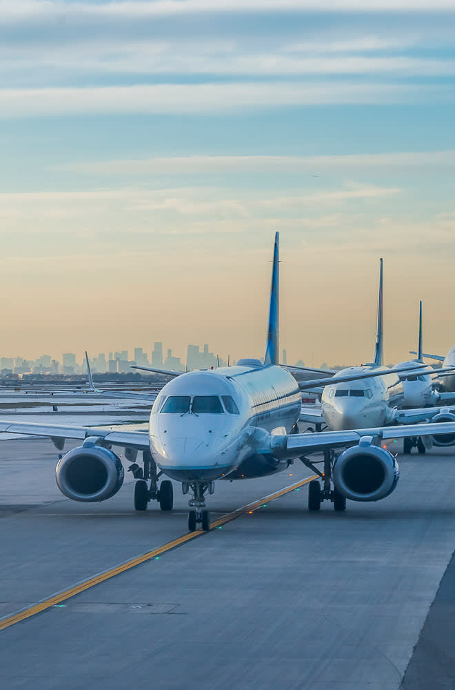 Planes in a row on a runway