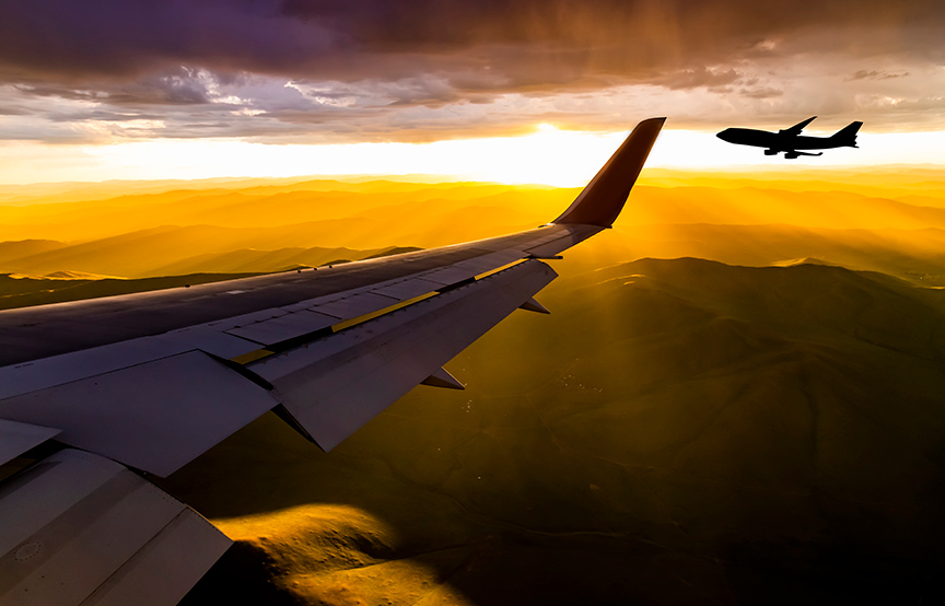 view from an airplane window of a flying plane