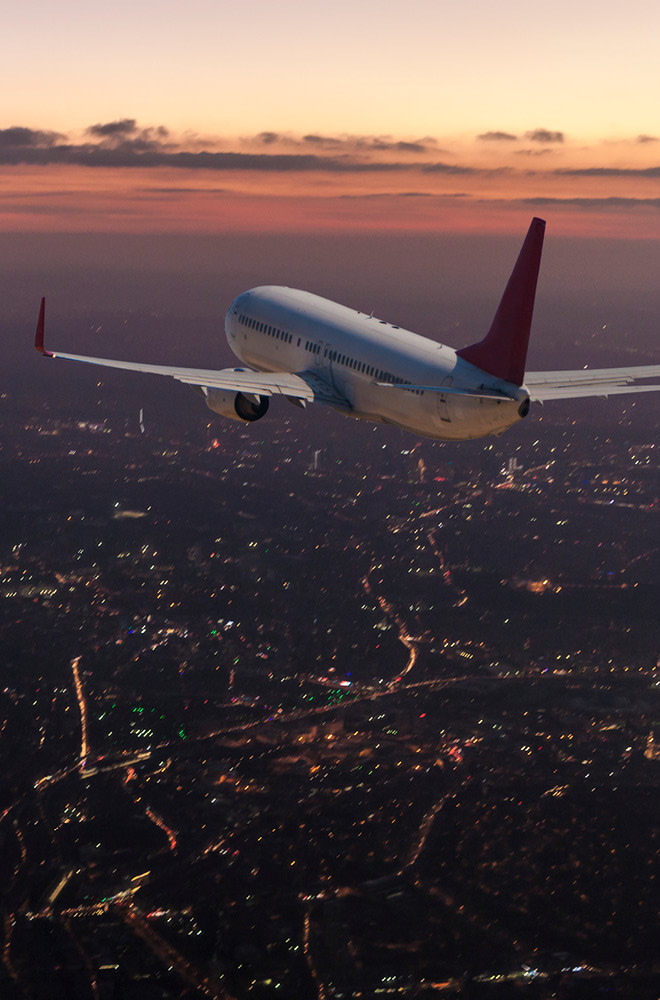 Plane over a cityscape