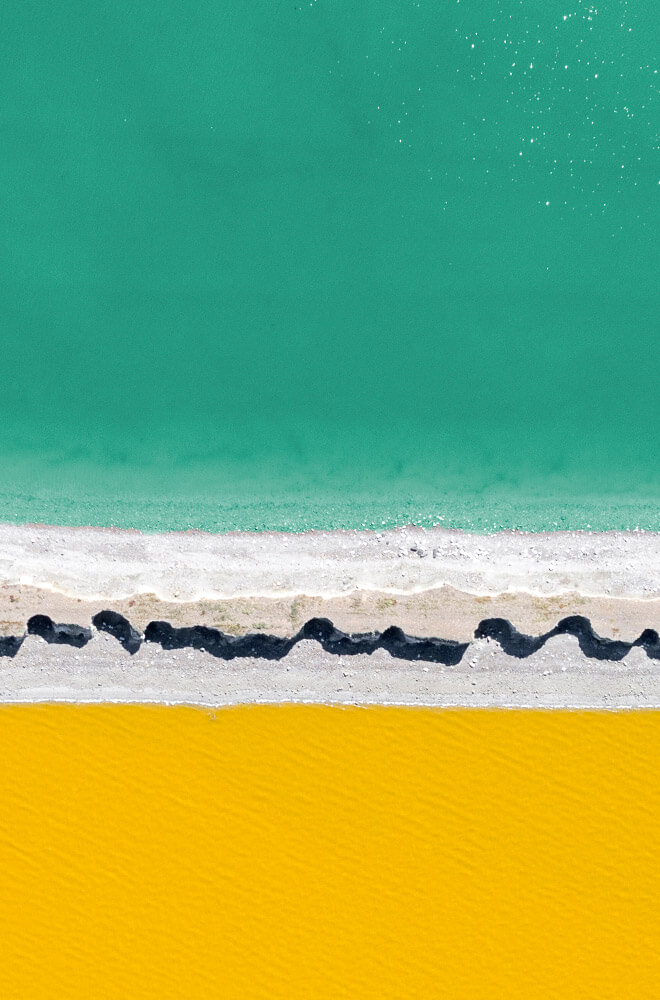 blue water and yellow sand