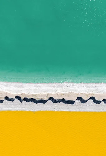 blue water and yellow sand