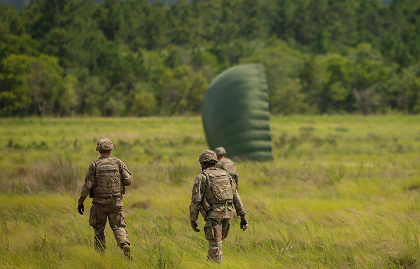 soldiers walking in the field 