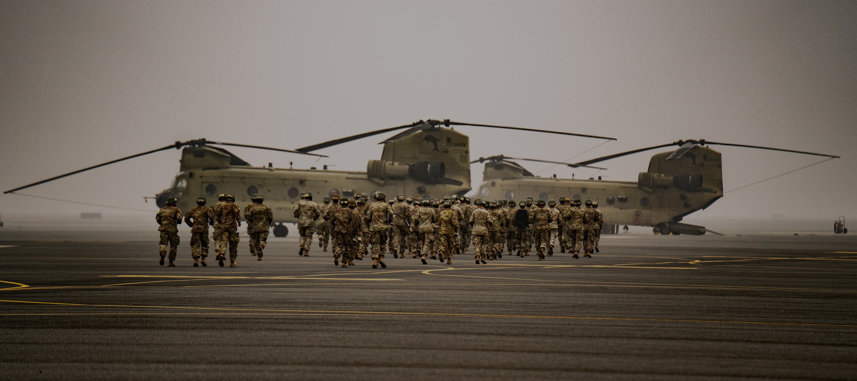 soldiers walking to military plane